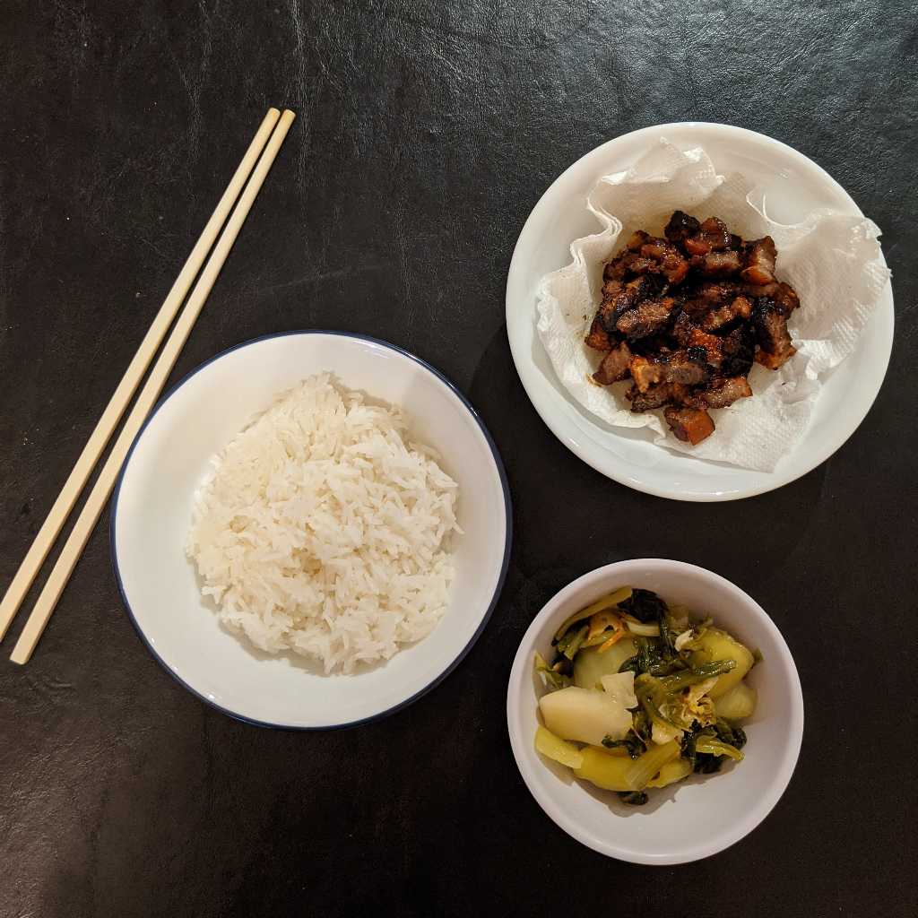 Lat bhat, pickled mustard greens, and rice