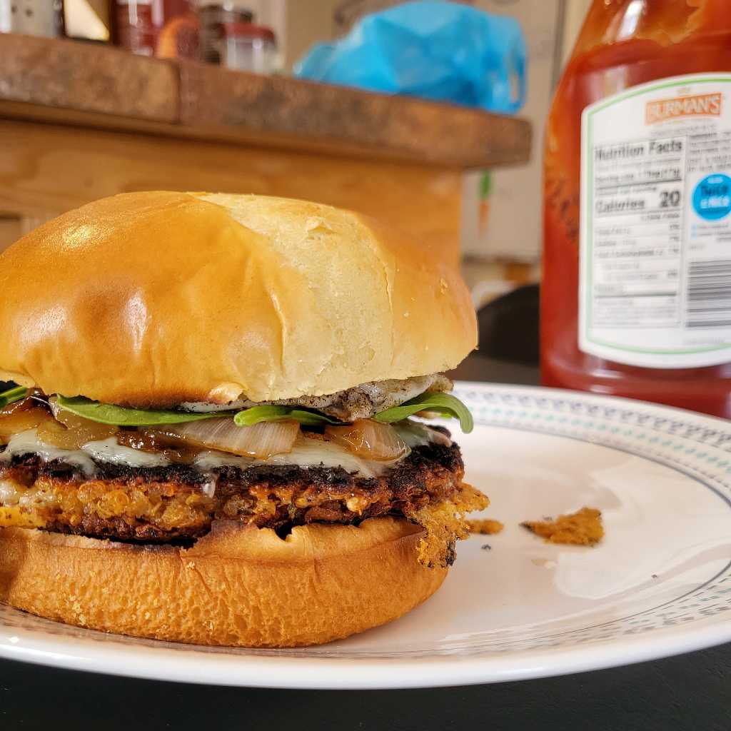 Closeup of a quinoa burger, fully assembled