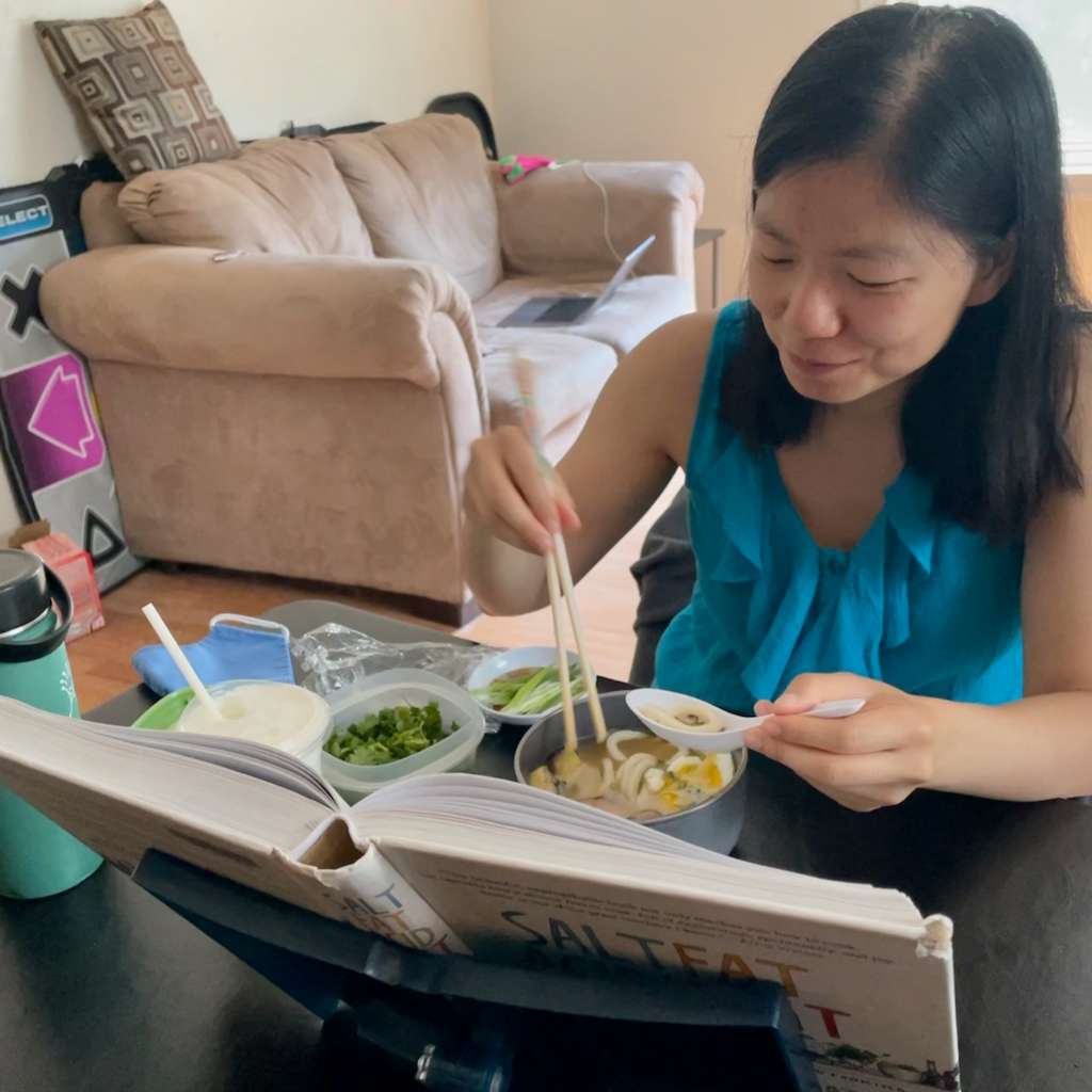 Me eating noodles while reading Salt, Fat, Acid, Heat