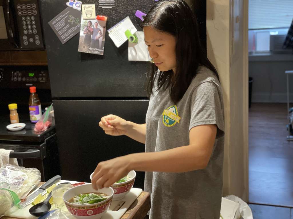 Me in my kitchen, assembling a bowl of noodles