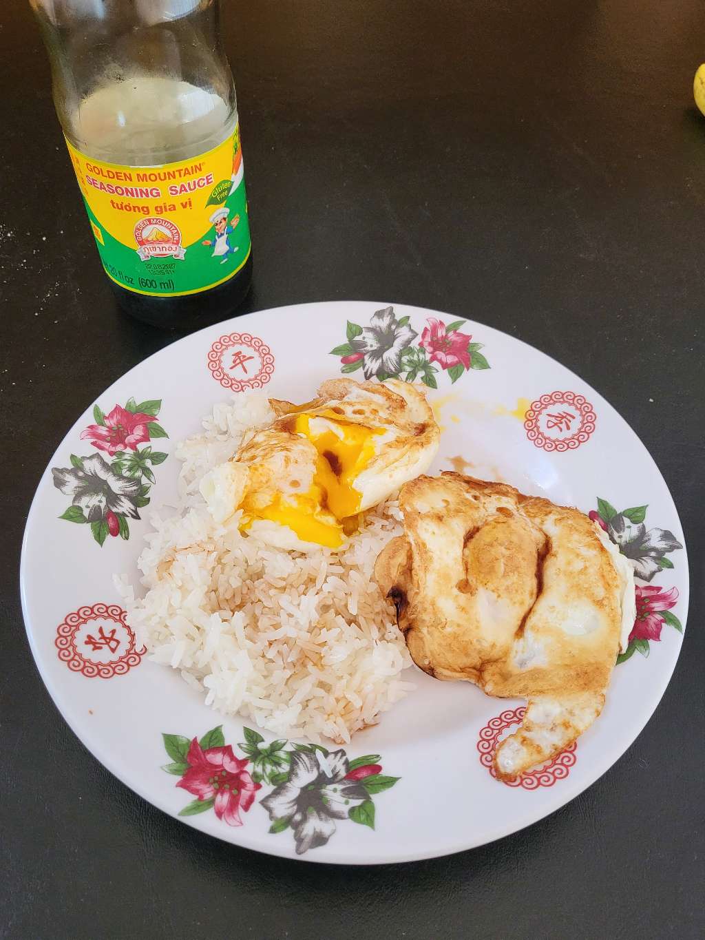 Fried eggs with rice and a bottle of Golden Mountain Seasoning Sauce