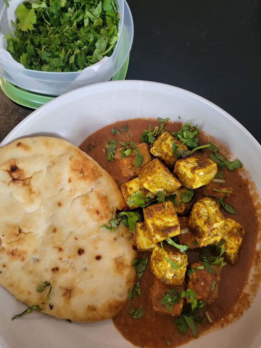Some butter tofu, with some extra tofu pieces thrown on top, as well as some cilantro