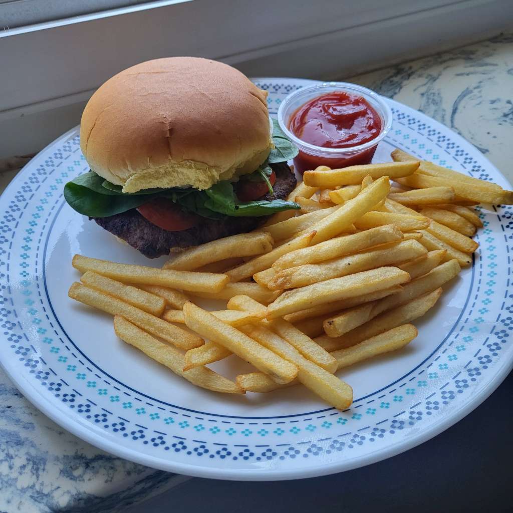 A less blurry photo of a burger and fries