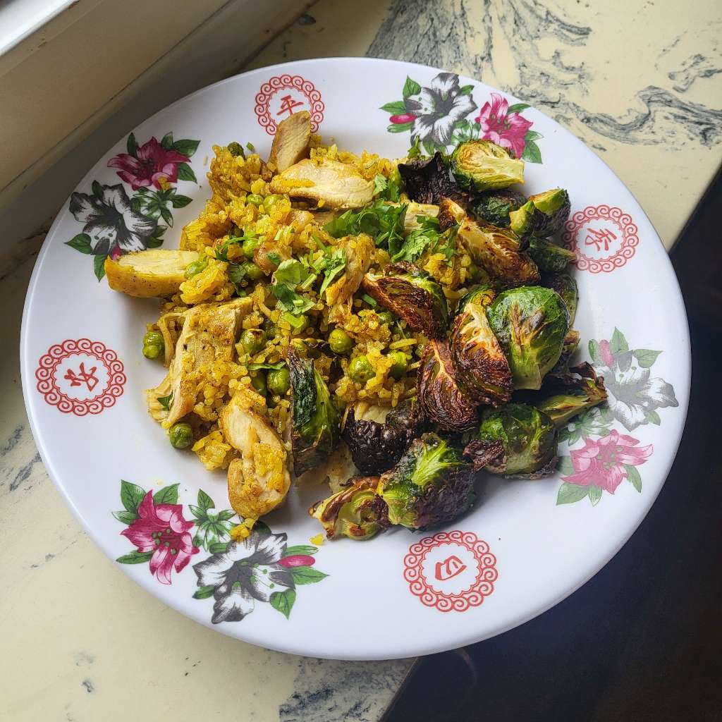 Yellow rice with chicken and brussels sprouts
