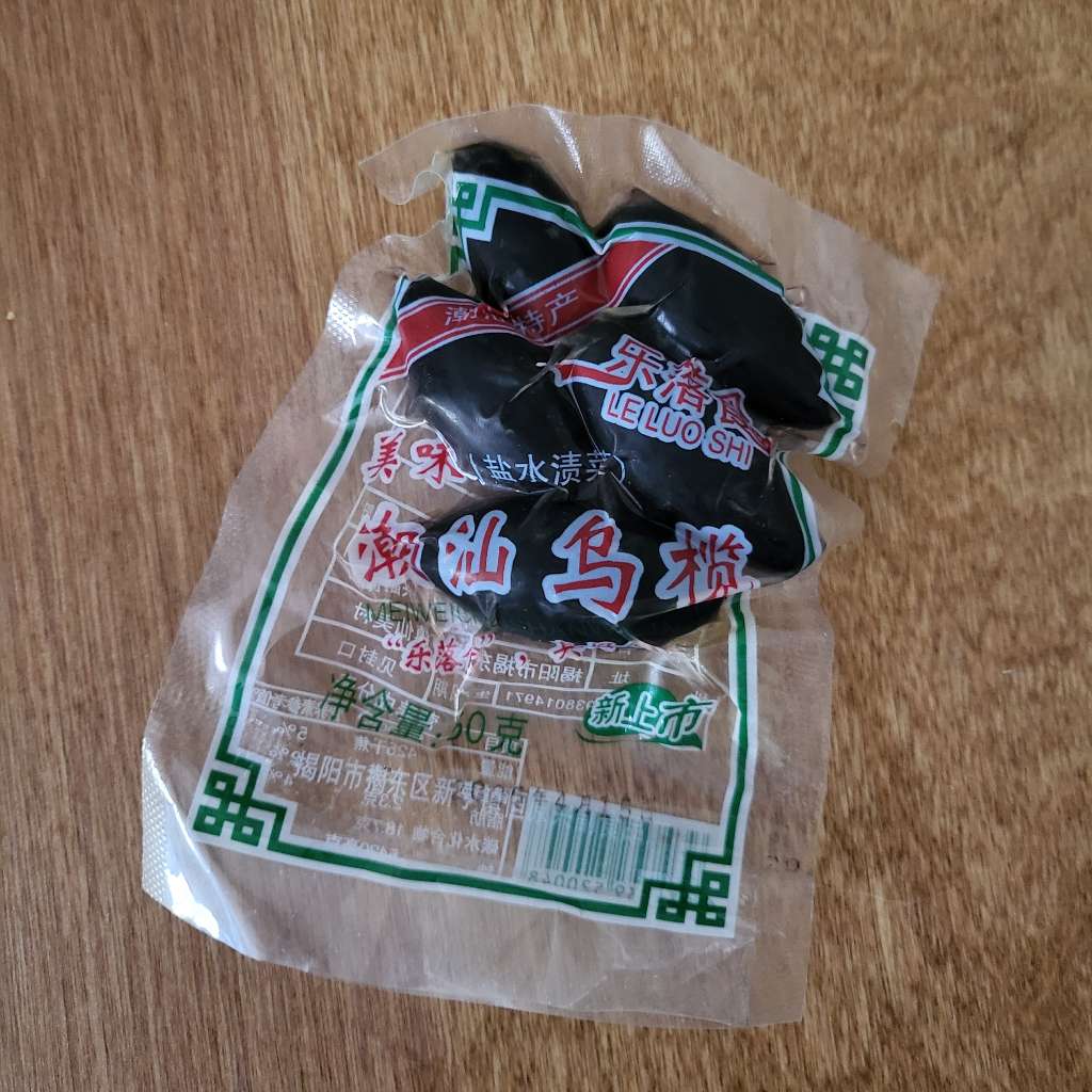 Five black olives in a vacuum sealed bag