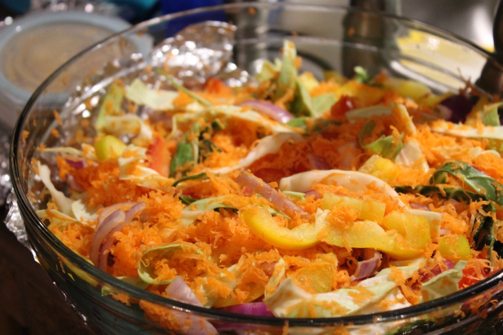 Salad with onions, bell peppers, cabbage, and shredded carrots